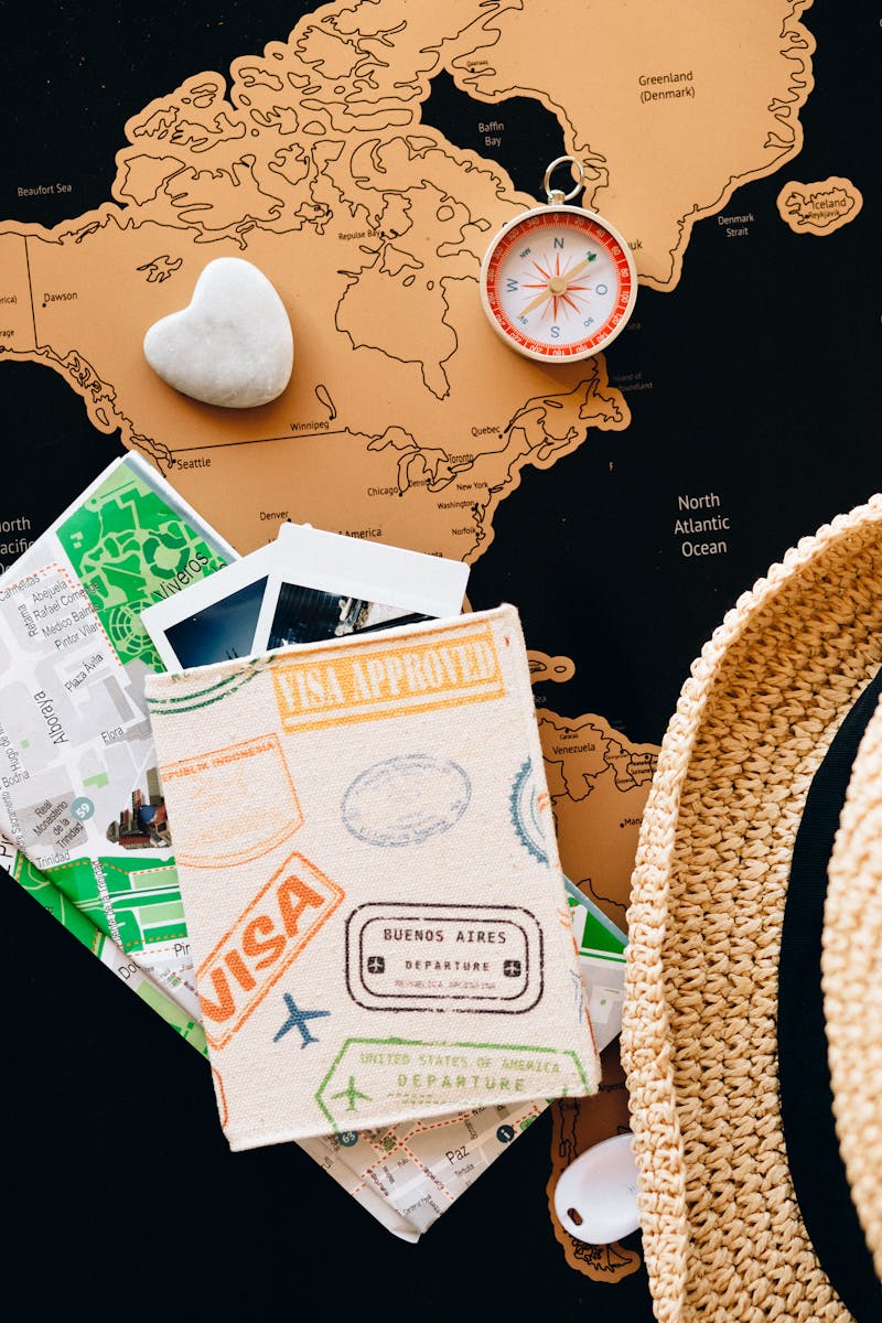 COURSES Explore destinations with a compass and passport on a world map. Perfect for adventure planning.